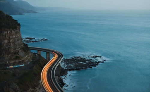 High angle view of road by sea against sky