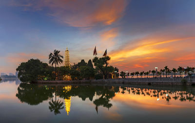 Reflection of clouds in water at sunset