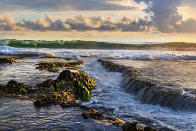 Scenic view of sea against sky during sunset