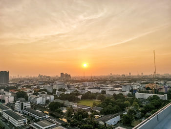 High angle view of buildings against sky during sunset