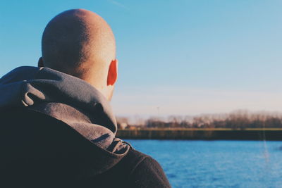 Rear view of man against sky
