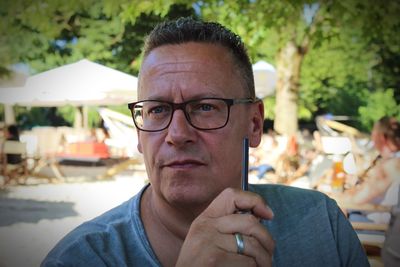 Close-up portrait of man wearing eyeglasses