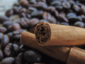 Close-up of cigarette on wood