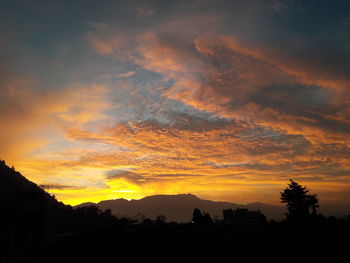 Scenic view of dramatic sky during sunset