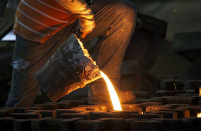 Molten iron poured into moulds