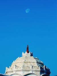 Low angle view of a building against blue sky