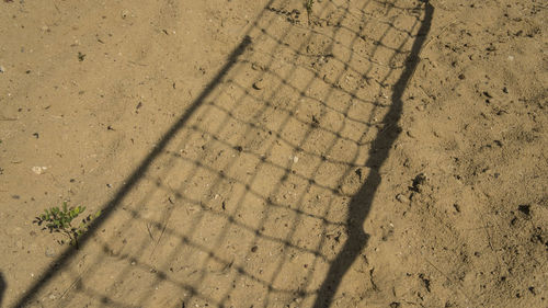 High angle view of footprints on sand