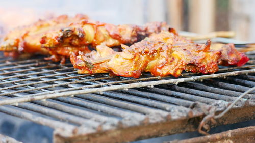 Close-up of meat on barbecue grill