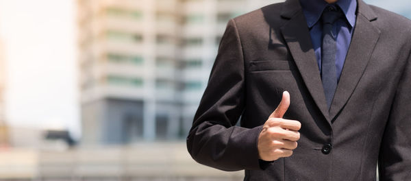 Midsection of man standing at home