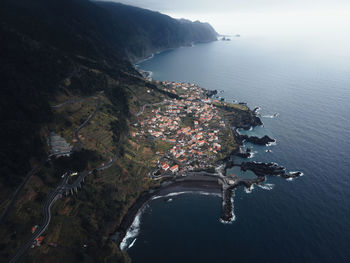 High angle view of city by sea