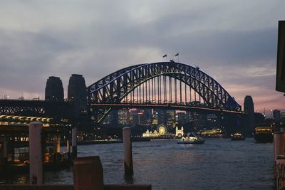 Low angle view of sydney harbour bridge at dusk