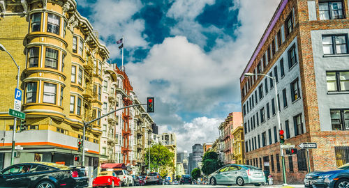 Panoramic view of city street and buildings against sky