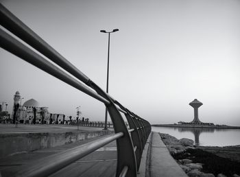 View of bridge over river against clear sky