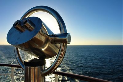 Coin-operated binoculars by sea in ship