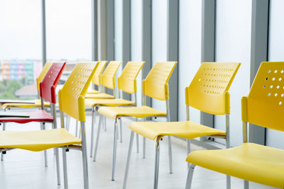 Rows of empty chairs await business seminar. modern conference room interior. corporate meeting