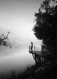 Low angle view of electricity pylon against clear sky