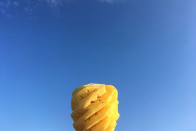 Close-up of bread against blue sky