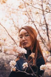 Portrait of young woman with flowers