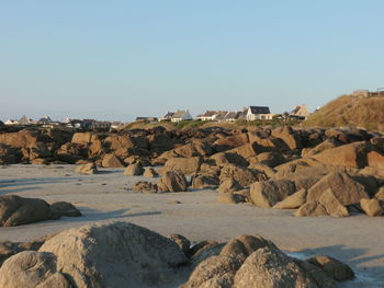 Scenic view of rocks against clear sky