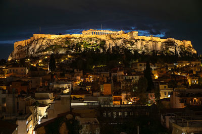 High angle view of buildings in city at night