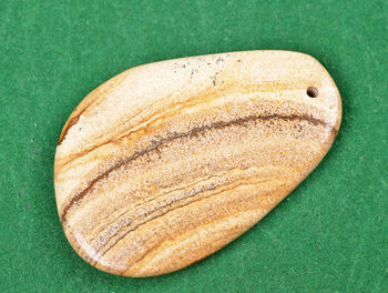 High angle view of bread on green background