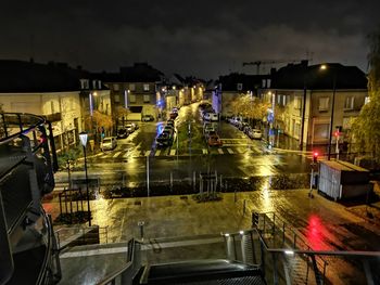 High angle view of illuminated city street at night