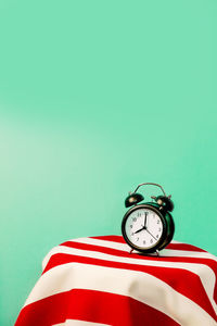 Close-up of clock against wall