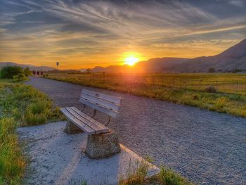 Scenic view of field against sky during sunset