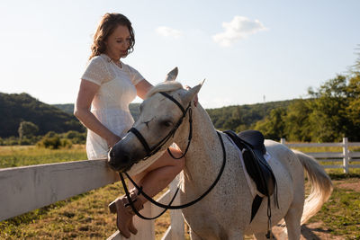 Man riding horse on field