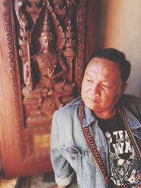 High angle view of thoughtful man looking away in temple