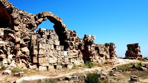 Old ruins of building against clear blue sky