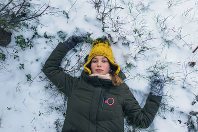 Girl lying in the snow