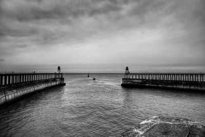 Pier over sea against sky