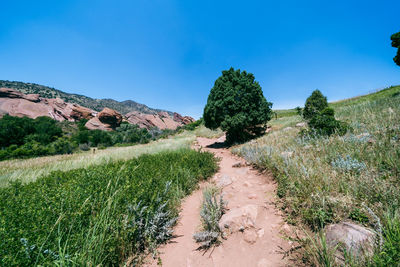 Scenic view of land against clear blue sky