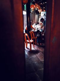 People standing on chair in city