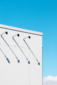 Low angle view of building against clear blue sky