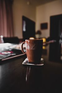 Close-up of coffee cup on table