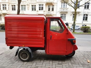 Red vintage car on street