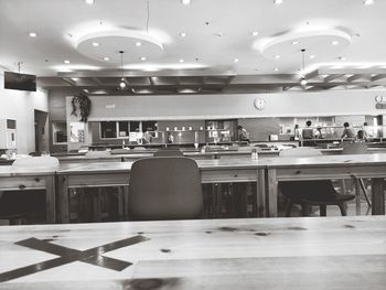 Empty chairs and tables in restaurant