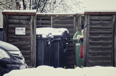 Rear view of man working on snow