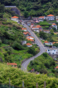 High angle view of road amidst buildings in city