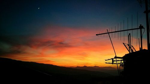 Silhouette landscape against scenic sky