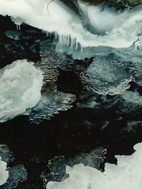 Close-up of frozen lake against sky