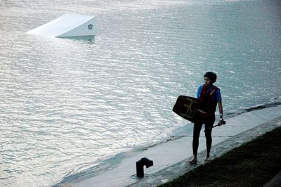 Full length of man standing in water