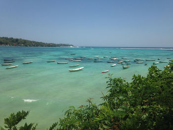 Scenic view of sea against clear blue sky