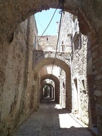 Narrow walkway leading to alley