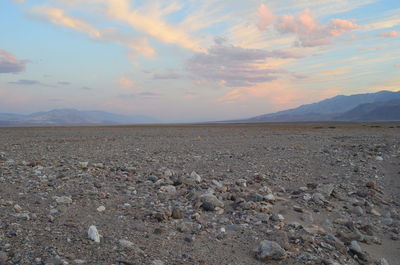 Scenic view of desert against sky during sunset