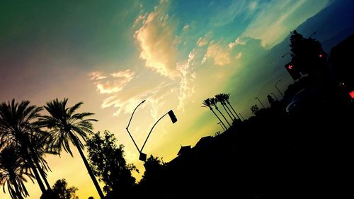 Low angle view of silhouette trees against sky at sunset