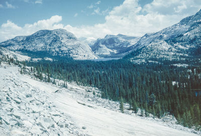 Scenic view of snow covered mountains against sky