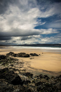 Scenic view of sea against cloudy sky